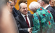 German Chancellor Olaf Scholz (C) talks with other attendants before consultations between...