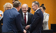 German Chancellor Olaf Scholz (C) talks with other attendants before consultations between...
