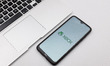 In this photo illustration a Xbox logo seen displayed on a smartphone screen on a desk nex...