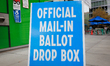 A mail-in ballot drop box sign is seen at the West End Public Library in Washington, D.C....