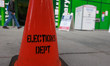 A District of Columbia Board of Elections traffic cone is seen as people cast mail-in ball...