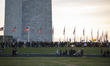 People march around the Washington Monument in Washington, D.C. on November 26, 2022 in me...