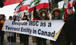Protestors hold a banner urging the Canadian government to list the Islamic Revolutionary...