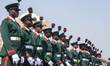 Members of the Nigerian armed forces march at the National Arcade Centre for the 2023 para...
