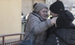 Ukrainian old lady arrives in Poland and hugs her relatives while crying. War refugees fro...