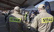 Firefighters help the arriving Ukrainian refugees. War refugees from Ukraine arrive at Prz...