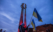 People holding Ukrainian and Polish flags attending the anti-war European Rally of Solidar...