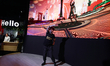  TA dancer performing on the Orange stand equipped with motion sensors that allow a virtua...