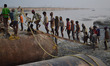 Indian labourers construct  pantoon bridge.a temporary bridge over Ganges river for  the u...