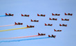 Newly-acquired aircrafts perform in the air during a parade in celebration of the 80th fou...