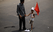A garments worker came with her son to attend may day rally.Garment workers & other labor...