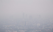 An aerial view of cityscape engulfed in smog amid hazy weather in Colombo on March 11, 202...