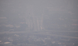 An aerial view of cityscape engulfed in smog amid hazy weather in Colombo on March 11, 202...