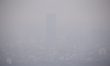 An aerial view of cityscape engulfed in smog amid hazy weather in Colombo on March 11, 202...
