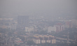 An aerial view of cityscape engulfed in smog amid hazy weather in Colombo on March 11, 202...