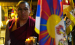 A monk participates in a candle light vigil to mark 64th Tibetan Uprising Day at Majnu ka...