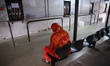 A Patien waits to receive medicine at a National Hospital Colombo as health workers hold a...
