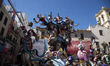  This photograph shows a 'falla' (a huge ornate cardboard sculpture made to eventually be...