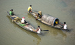 Fishermen row their fishing boat in the Brahmaputra river in Guwahati, Assam, India on 18...