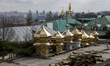 Golden domes and crosses located on pallets on the territory of the monastery complex of t...