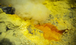 Sulfur stalactites are seen frozen after dripping from a pipe as molten sulfur in the crat...