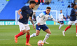 Max Aarons of England U21 puts pressure on Valentin Gendrey of France U21 during the Inter...