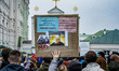 A banner against the connections between Putin and the patriarchs of the Moscow Church in...