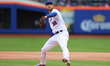 New York Mets starting pitcher Tylor Megill (38) throws during the third inning of a baseb...