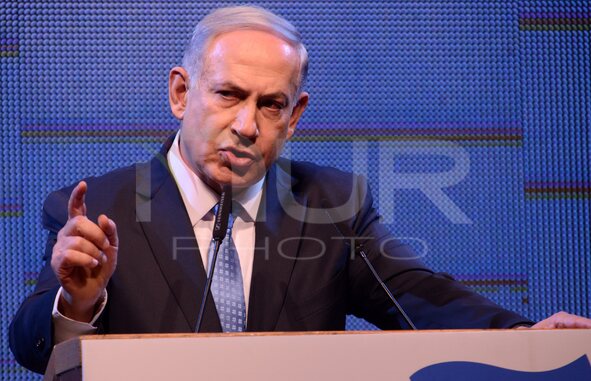 Israeli Prime Minister and leader of the Likud Party Benjamin Netanyahu speaks to party members, at the Party conference in Tel Aviv