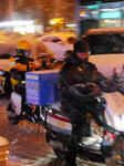 Courier Working Braves Snow in Beijing.