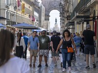 People are seen walking in Da Prata street, in the neighborhood of Baixa, Lisbon. 02 May 2023. (
