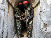 Fighters from the Democratic Front for the Liberation of Palestine (DFLP) walk in a tunnel  in the southern Gaza Strip during preparation an...