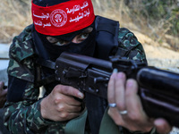 Fighters from the Democratic Front for the Liberation of Palestine (DFLP) take part in training drills in the southern Gaza Strip, on May 19...