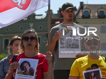 KRAKOW, POLAND - MAY 21, 2023:
Unified in solidarity, members of the local Belarusian and Ukrainian diaspora, hold pictures of detained peop...