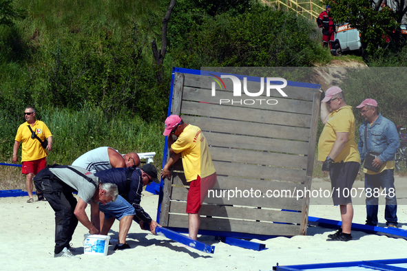 ODESA, UKRAINE - MAY 21, 2023 - Rescuers set up their towers on the ''Dog Beach'', Odesa, southern Ukraine. NO USE RUSSIA. NO USE BELARUS.