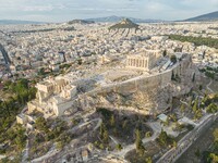 Aerial panoramic view from a drone of the Acropolis of Athens, a rocky outcrop above the city of Athens with many remains of several ancient...