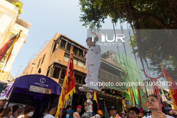 

In Hong Kong, China, on May 26, 2023, a child is being hoisted on a support during a procession for the Bun Festival of Cheung Chau. This...