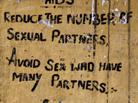 Sign advising people to avoid having sex with those who have has many sexual partners to reduce the spreads of the HIV Aids virus in the sma...