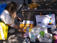 

Several children drawing with teddy bears are seen during the demonstration and call for the EU to save Ukrainian children in Duesseldorf,...