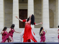 Jeanne Bresciani and the dancers of the Isadora Duncan International Institute of New York are performing a dance in the style of Duncan ent...
