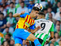 Gabriel Paulista of Valencia CF competes for the ball with Borja Iglesias of Real Betis during the LaLiga Santander match between Real Betis...