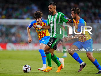 Borja Iglesias of Real Betis competes for the ball with Nico Gonzalez  of Valencia CF during the LaLiga Santander match between Real Betis a...