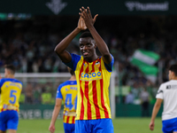 Mouctar Diakhaby of Valencia CF shows appreciation to the fans during the LaLiga Santander match between Real Betis and Valencia CF at Benit...