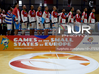 
TA' QALI, MALTA:
Luxembourg players and officials listen to their country's national anthem after winning the Gold Medal after the Men's 5...