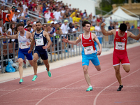 

MARSA, MALTA:
Malta's Graham Pellegrini (R) crosses the finishing line to secure a Gold medal during the Men's 200m Final event from the G...