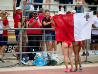 

MARSA, MALTA:
Malta's Carla Scicluna (L, partially hidden) and Janet Richards (R, partially hidden) celebrate winning the Silver and Bronz...