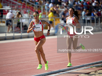 

MARSA, MALTA:
Malta's Lina Bezzina (L) and Gina McNamara (R) lead the pack in the Women's 5000m Final event from the Games of the Small St...