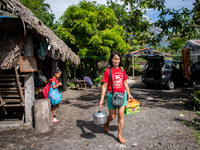 Residents evacuate from their houses as the Mayon Volcano remains under alert level 3, in Santo Domingo, Albay province, Philippines, on Jun...