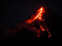 Lava and ashes flow from the Mayon Volcano which remains under alert level 3, in Legazpi, Albay province, Philippines, on June 12, 2023. (