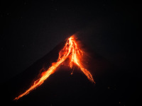 Lava and ashes flow from the Mayon Volcano which remains under alert level 3, as seen in Legazpi, Albay province, Philippines, on June 13, 2...